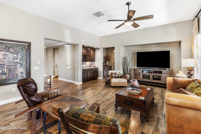 living room with hardwood / wood-style flooring and ceiling fan