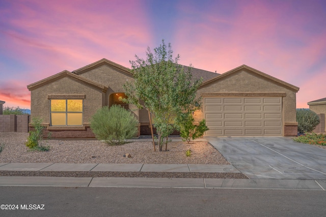 ranch-style home featuring a garage