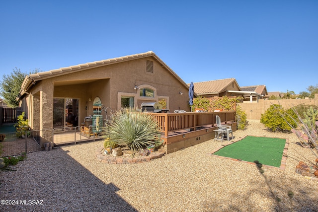 rear view of property featuring a patio area