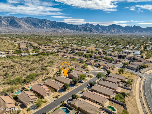 birds eye view of property with a mountain view