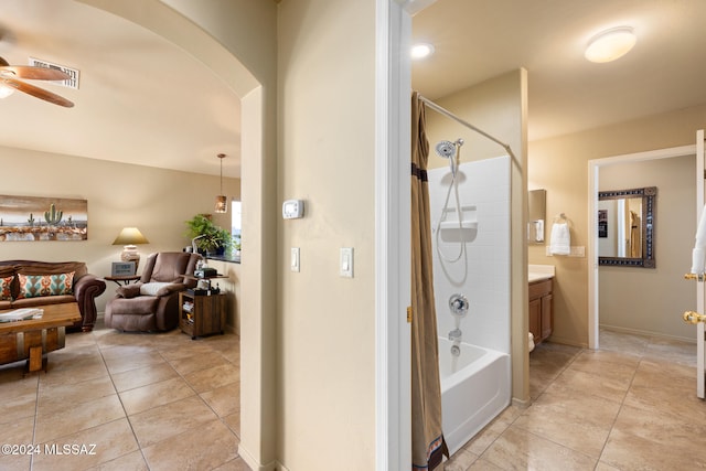 bathroom with vanity, shower / bathing tub combination, tile patterned flooring, and ceiling fan