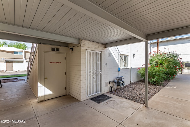 property entrance featuring a patio area