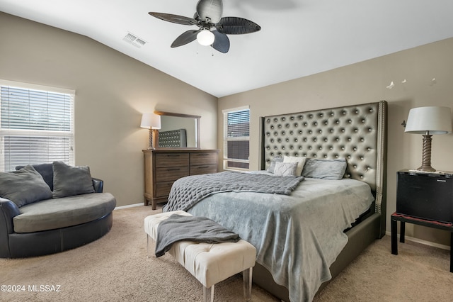 bedroom featuring ceiling fan, light colored carpet, and lofted ceiling