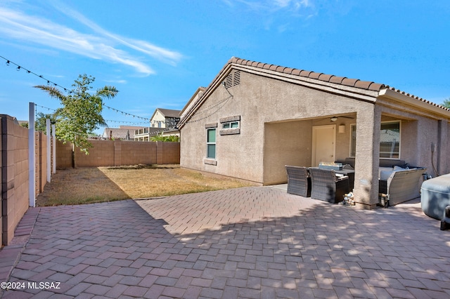 exterior space with an outdoor living space and a patio area