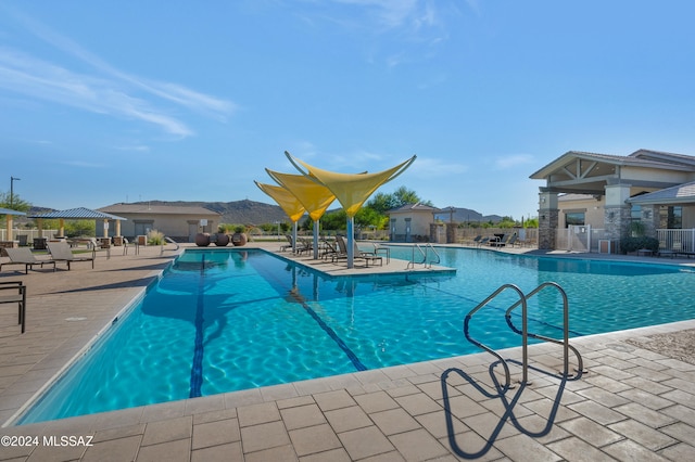 view of swimming pool featuring a gazebo and a patio area