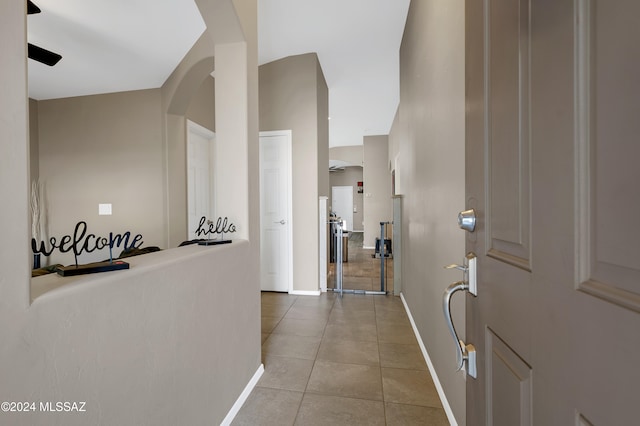 hallway with light tile patterned floors