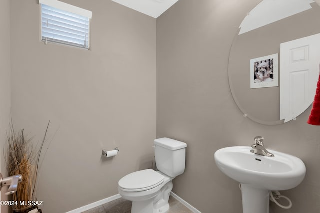 bathroom featuring sink and toilet