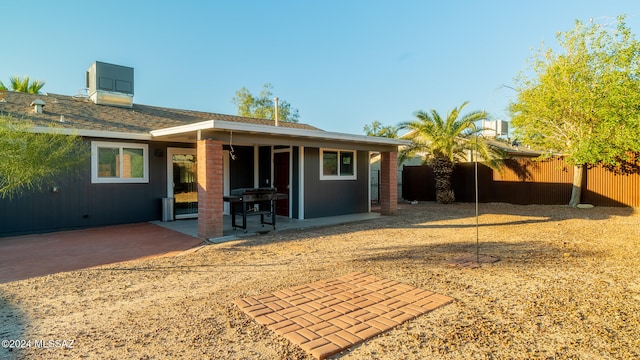 back of house with a patio area