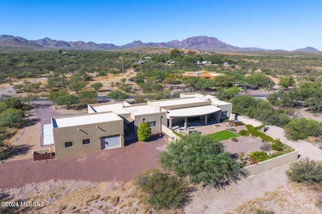 birds eye view of property featuring a mountain view