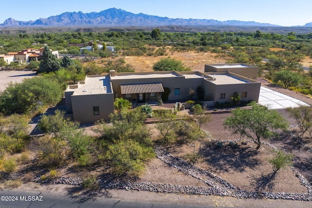 birds eye view of property with a mountain view