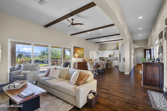 living room with beam ceiling and hardwood / wood-style flooring