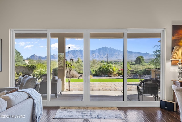 entryway featuring a mountain view and dark hardwood / wood-style flooring