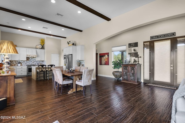 dining space with dark wood-type flooring and beam ceiling