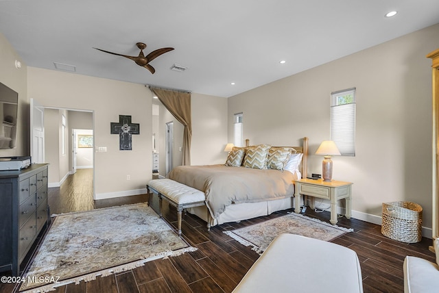 bedroom with dark hardwood / wood-style floors and ceiling fan