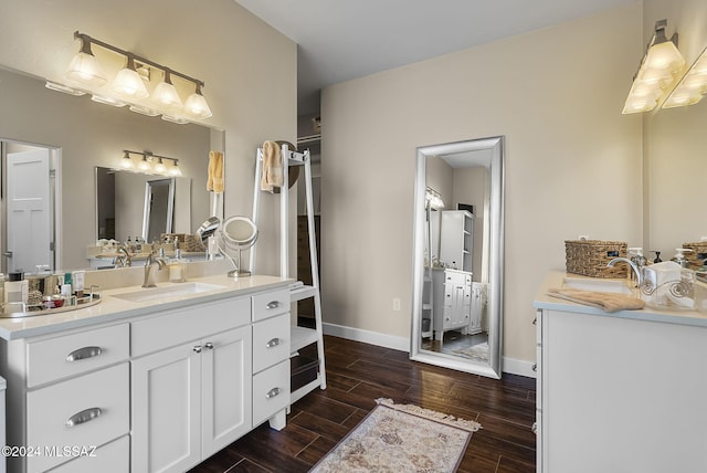 bathroom with vanity and hardwood / wood-style floors