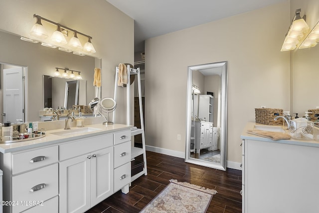 2321 Circulo De Anza, Tubac, AZ 85646 - full bath with two vanities, wood finished floors, and baseboards