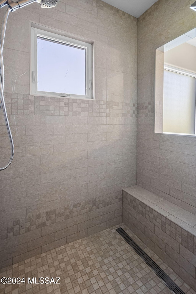 bathroom featuring tiled shower