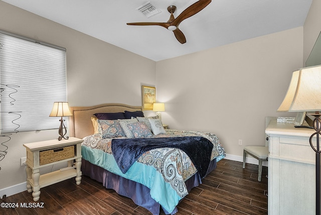 bedroom featuring ceiling fan and dark hardwood / wood-style flooring