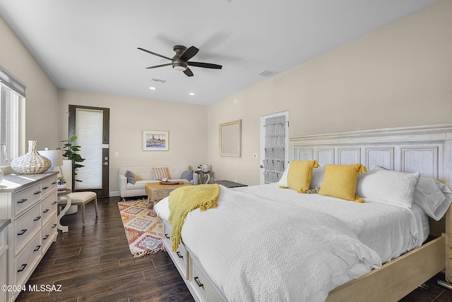 bedroom with dark hardwood / wood-style floors and ceiling fan