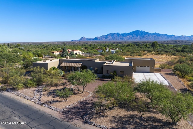 2321 Circulo De Anza, Tubac, AZ 85646 - adobe home featuring stucco siding, a mountain view, a garage, and concrete driveway