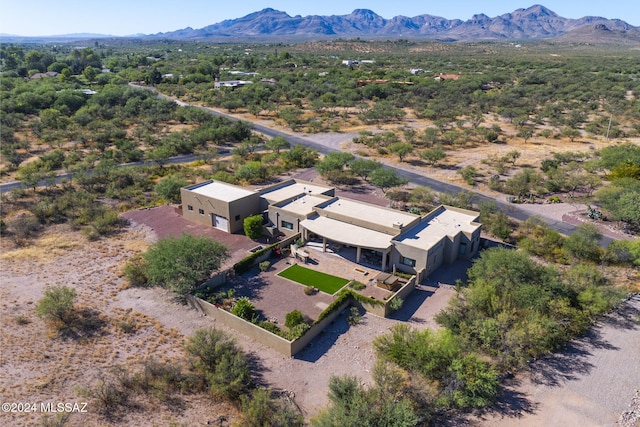 birds eye view of property featuring a mountain view