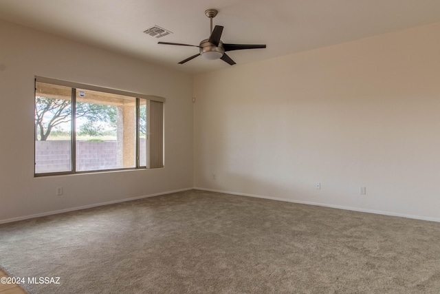 spare room with carpet flooring and ceiling fan