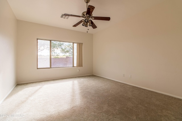 unfurnished room featuring carpet and ceiling fan