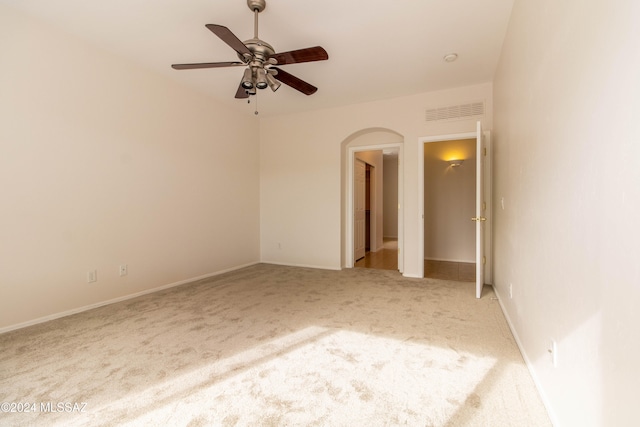 empty room with carpet floors and ceiling fan