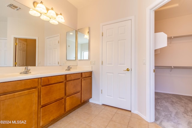 bathroom featuring vanity and tile patterned flooring