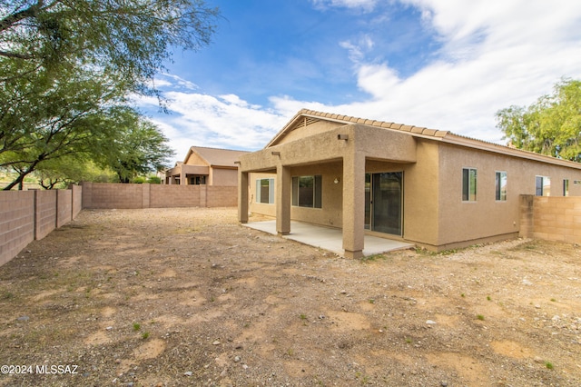 rear view of house featuring a patio