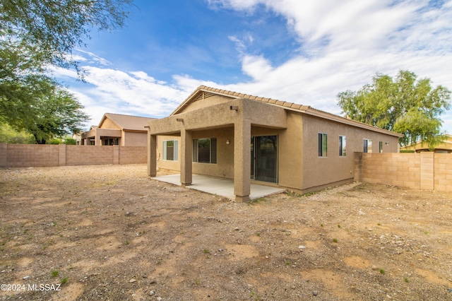 rear view of house featuring a patio