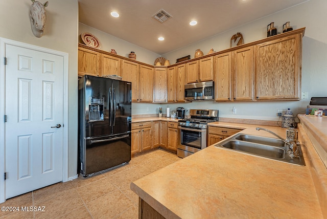 kitchen featuring stainless steel appliances and sink