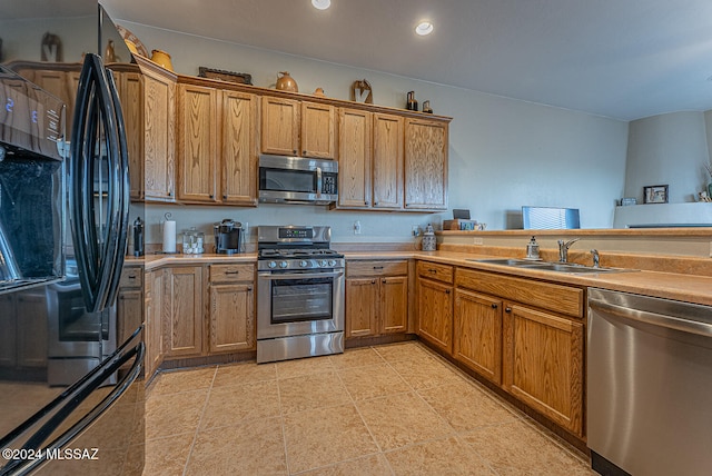 kitchen featuring appliances with stainless steel finishes and sink