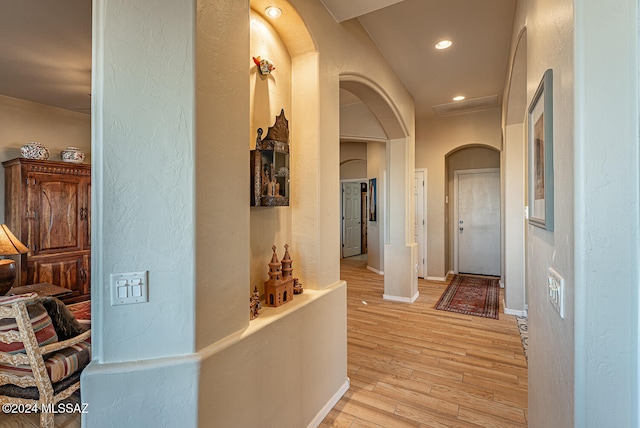 hall with light hardwood / wood-style floors