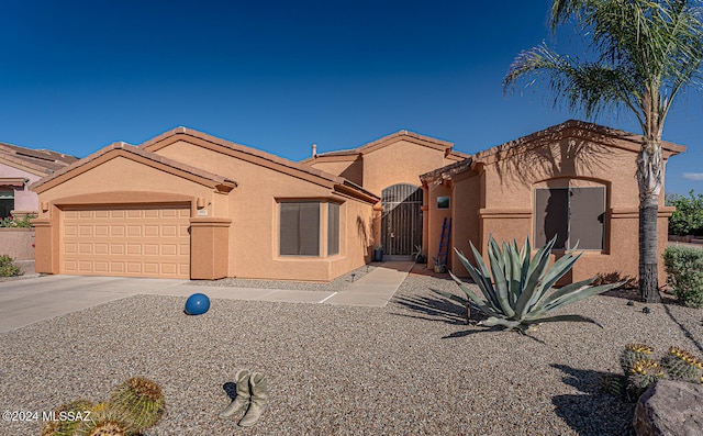 view of front of property with a garage