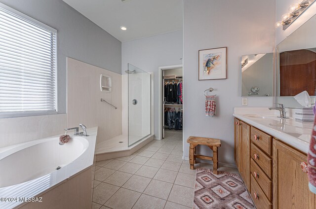 bathroom with vanity, tile patterned floors, plenty of natural light, and separate shower and tub