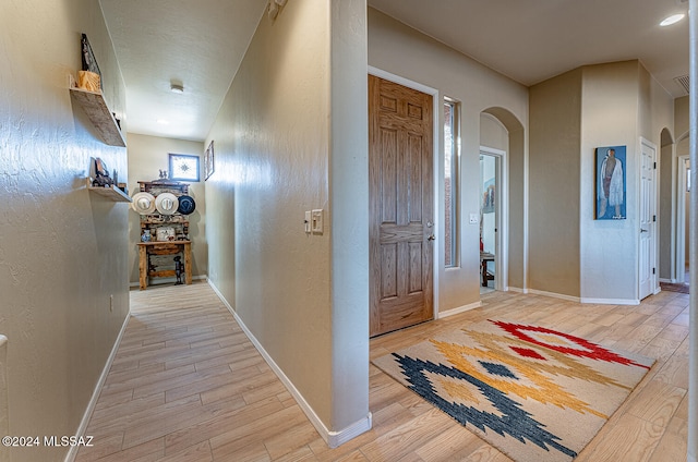 hallway featuring light hardwood / wood-style flooring