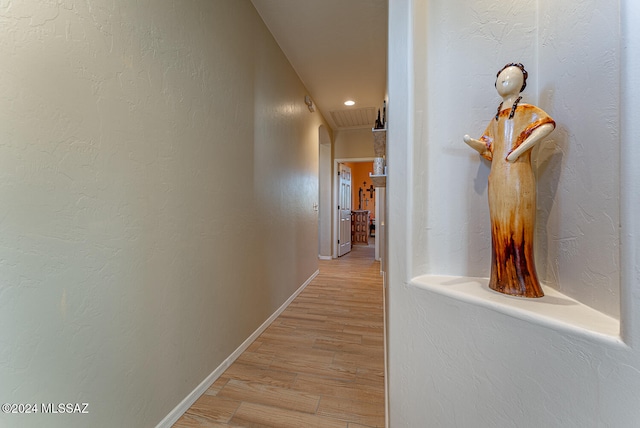 corridor with light wood-type flooring