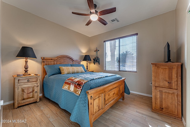 bedroom featuring light hardwood / wood-style floors and ceiling fan