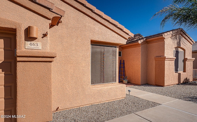 view of side of home with a patio area