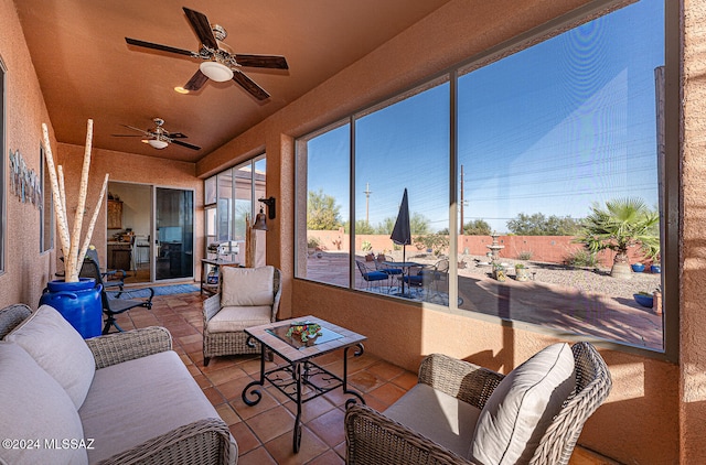 sunroom with ceiling fan