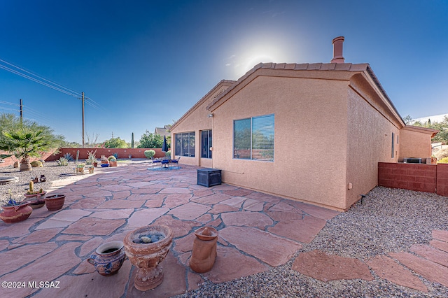 back of property featuring a patio