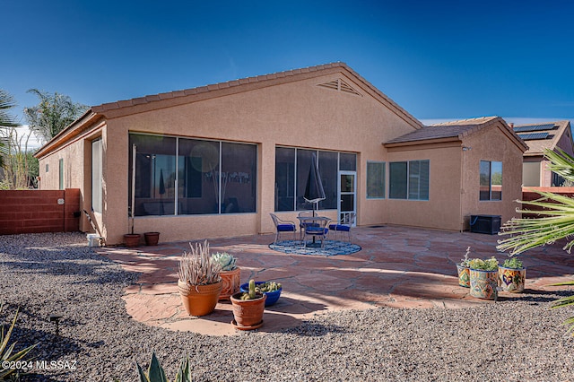 back of house featuring a patio area