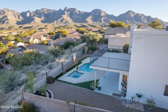 view of swimming pool with a mountain view