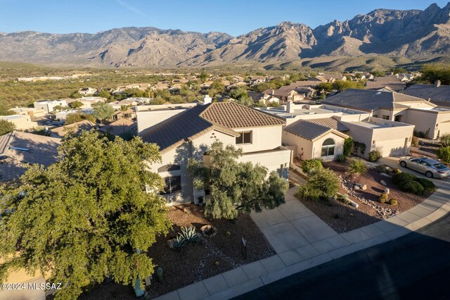 drone / aerial view with a residential view and a mountain view