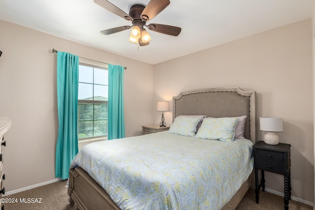 bedroom with a water view, carpet flooring, and ceiling fan