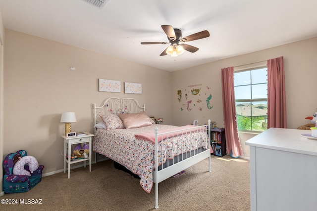 bedroom with ceiling fan and light carpet