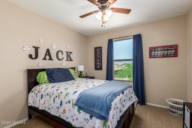 bedroom with ceiling fan and carpet flooring