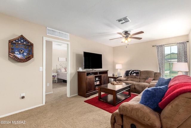 living room with light carpet and ceiling fan