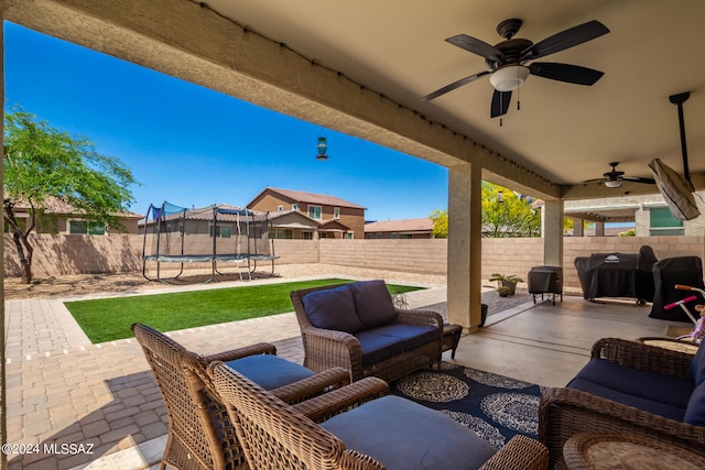 view of patio / terrace with an outdoor hangout area, a trampoline, and ceiling fan